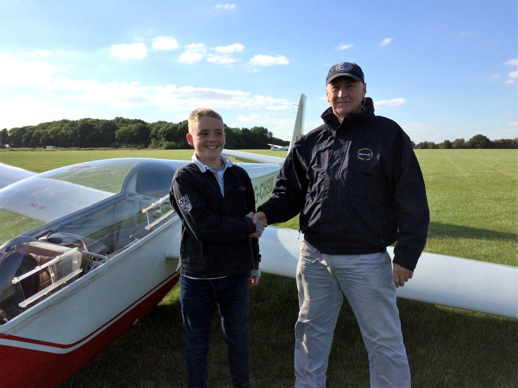 Instructor Barry congratulates Ben after his landing.